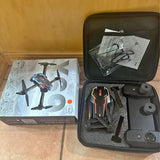 FPV drone kit in hard case with remote controller and folded drone propellers