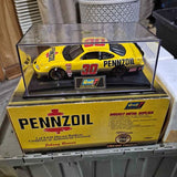 Revell 1:24 diecast race car model, yellow Pennzoil #30 in clear display case