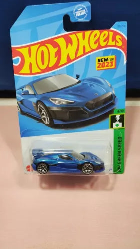 Hot Wheels diecast car in blister pack, blue and black coupe