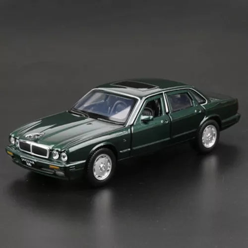 Green 1:36 diecast Jaguar XJ6 model car with chrome grille and clear headlights