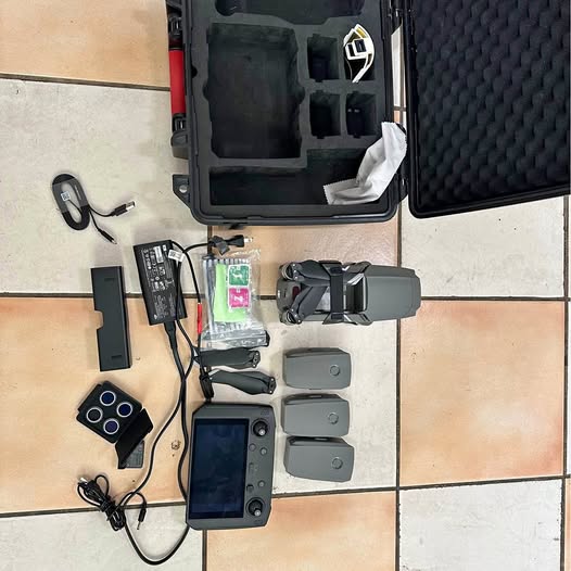 DJI Mavic 2 Zoom drone kit with controller, batteries, chargers, and remote screen.