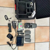 DJI Mavic 2 Zoom drone kit with controller, batteries, chargers, and remote screen.