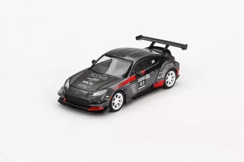1:64 diecast race car model, black with red accents and rear spoiler