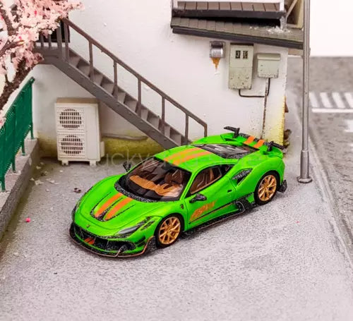 Green racing sports car diecast model with black roof and orange stripes