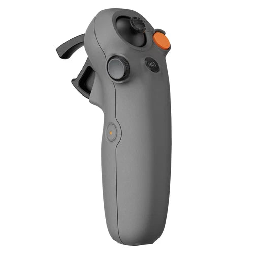 Handheld motion controller with thumbstick and orange button, matte gray