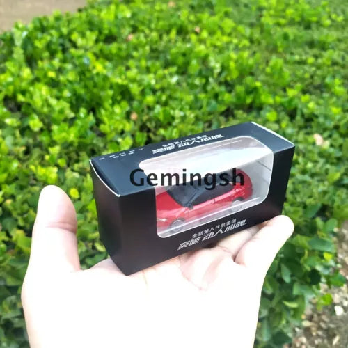 Diecast model car in retail box with window showing a red Camry model