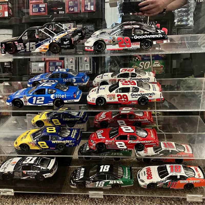 NASCAR diecast display case with multiple race car models behind clear glass