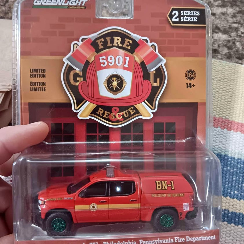 Red and yellow diecast fire truck with emergency light, Philadelphia Fire Department badge
