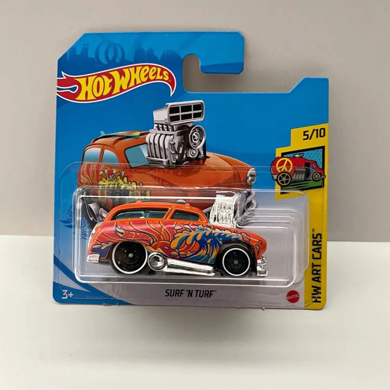 Orange Hot Wheels diecast art car in blister package, flame graphics and front grille.