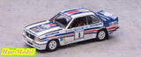 Diecast rally model car, white with blue red stripes and number 1 on doors