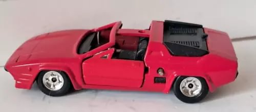 Red Lamborghini diecast sports car model with open cockpit detail, side view