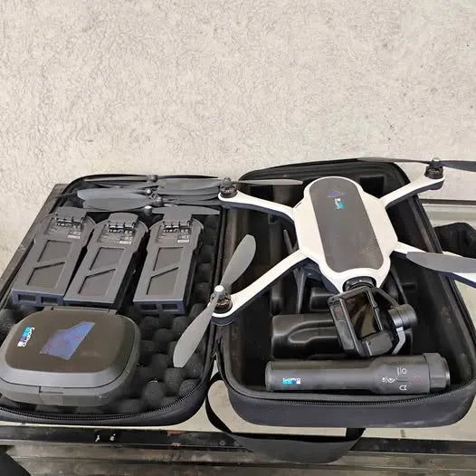 Drone accessory kit in open hard case with white quadcopter and controller