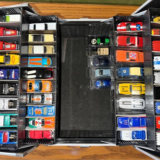 1/64 diecast car set in open display case, multiple colorful model cars
