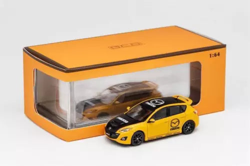 1:64 diecast model car toy, yellow sports hatchback with black stripes, in box