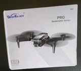 Foldable RC drone on retail box, black and gray quadcopter with camera