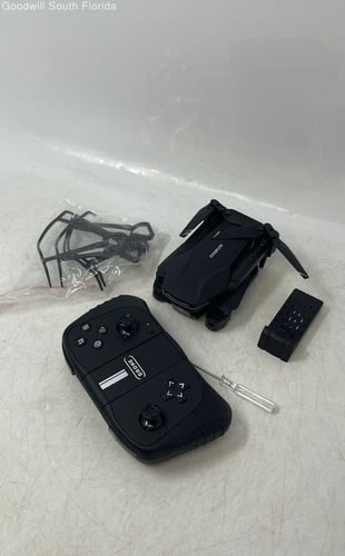 Black foldable remote control quadcopter camera drone with handheld controller and battery