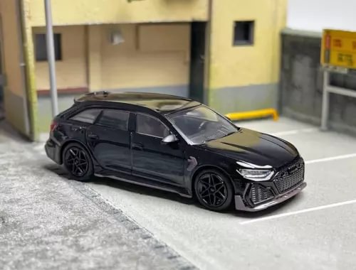 Black alloy diecast car model, front 3/4 view with detailed grille