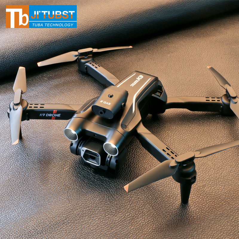 Mini drone with four propellers and front camera, dark gray body