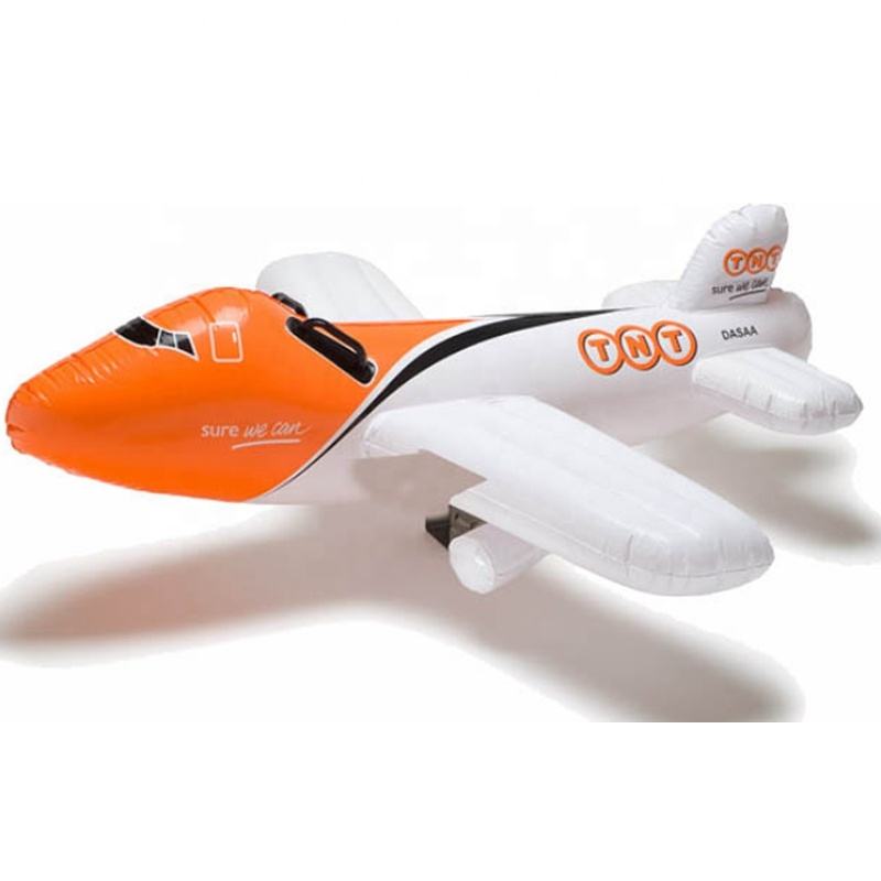 Inflatable toy airplane with orange-and-white body and printed logo graphics