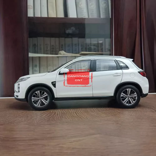 1:18 scale white Mitsubishi ASX diecast SUV model, side view