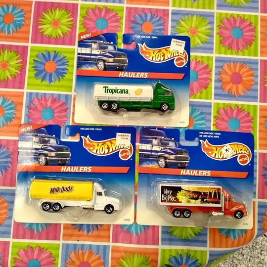 Three Hot Wheels Haulers diecast truck vehicles in retail blister packaging