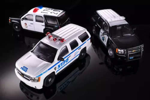 Diecast police SUV model car with white body and blue stripe, open hood detail