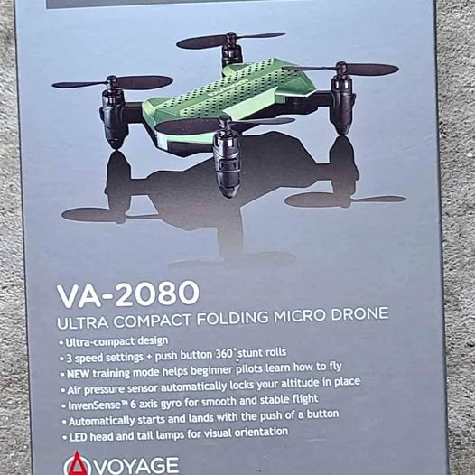 Compact folding micro drone with four propellers and landing legs