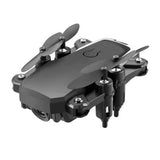 Mini camera drone with four rotors and camera lens on top, dark gray body