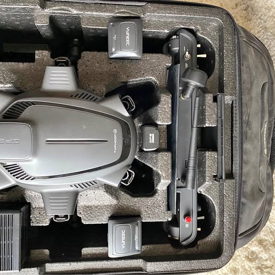Yuneec hexacopter drone in hard case, gray body with arms and landing gear