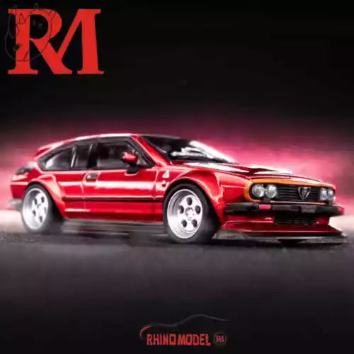 Red diecast toy sports car model with front grille and headlights, front three-quarter view