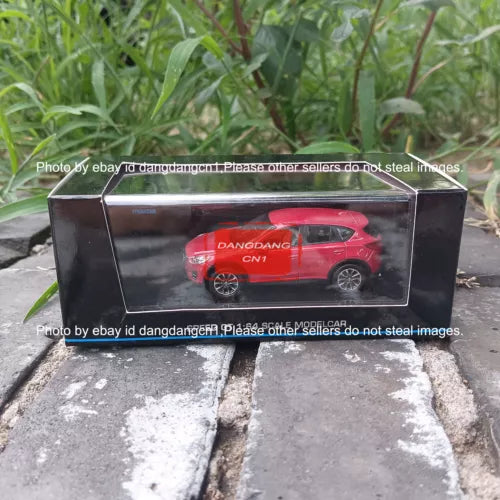 Red off-road SUV diecast model toy in clear display box