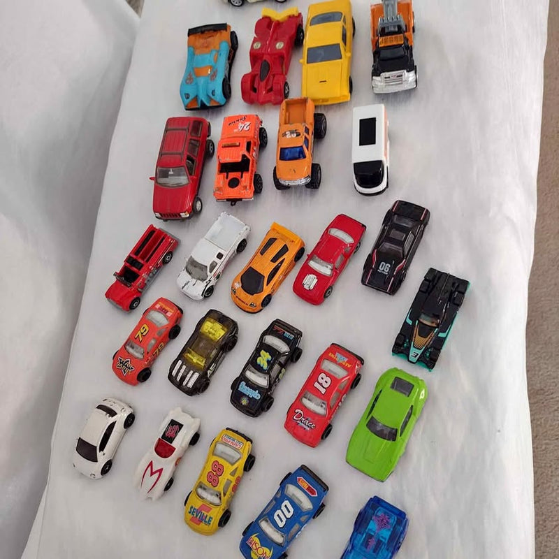 Assorted toy cars and trucks, mixed colors and styles