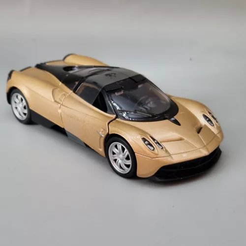 Pagani Huayra diecast model car, gold body with black hood and roof, silver wheels