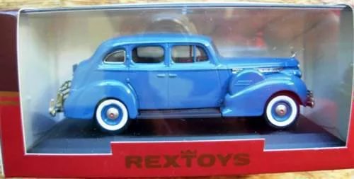 Blue diecast classic car model in display box, front three-quarter view