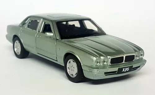 Light green diecast Jaguar XJ6 sedan model car, front three-quarter view, LHD