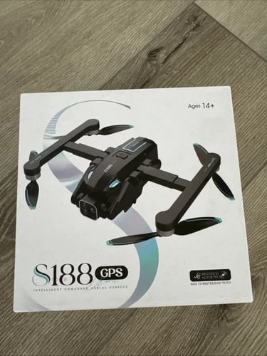 Drone in retail box with GPS, four rotors, and age 14+ label