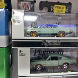Teal die-cast model car in clear blister pack with Plymouth logo