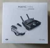 DJI Mavic Mini drone with remote control, packaged in retail box