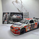 Red and white NASCAR diecast race car, number 18, front three-quarter view