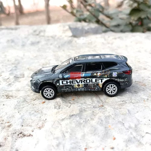 Gray diecast model car SUV with Chevrolet graphics, detailed wheels and windows