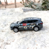 Gray diecast model car SUV with Chevrolet graphics, detailed wheels and windows