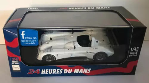 White diecast race car model in a display box, 1/43 scale.