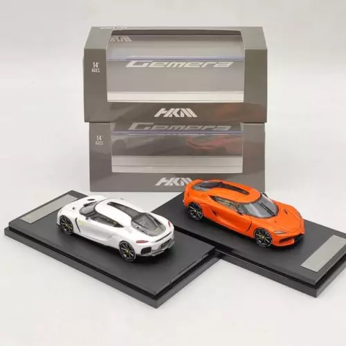 1:64 diecast supercar model set with white and orange cars on display bases