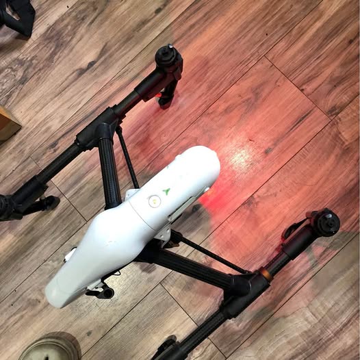 White DJI Inspire 1 quadcopter drone with gimbal camera and landing gear