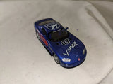 Blue diecast race car with flame graphics and hood number 03, front 3/4 view
