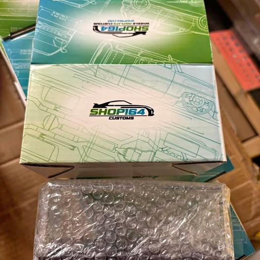 Acrylic diecast case in clear bubble wrap, in retail box packaging
