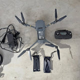 DJI Mavic Pro drone with controller and accessories, folded arms and propellers visible