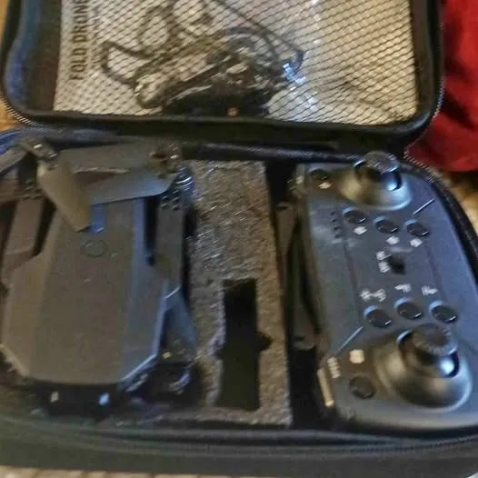 Drone controller in hard case with textured grip and button controls