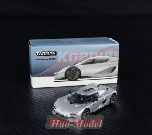 Silver alloy diecast sports car model with black wheels, in display box