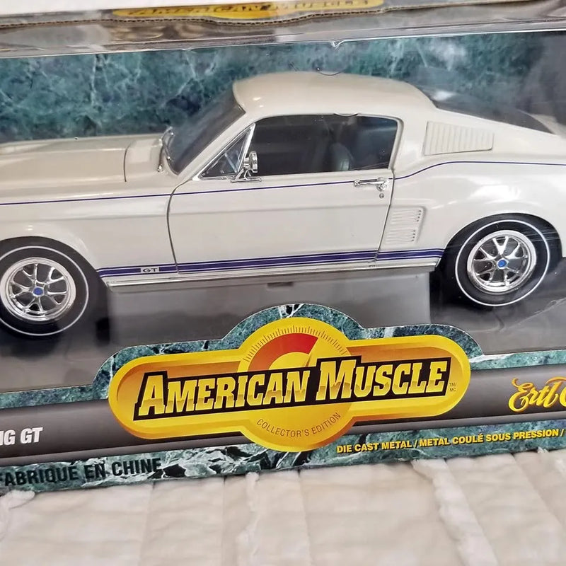 White diecast muscle car model with blue side stripe and chrome wheels